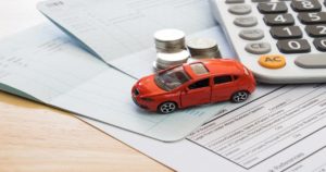 Car and money representing financial recovery in a car accident